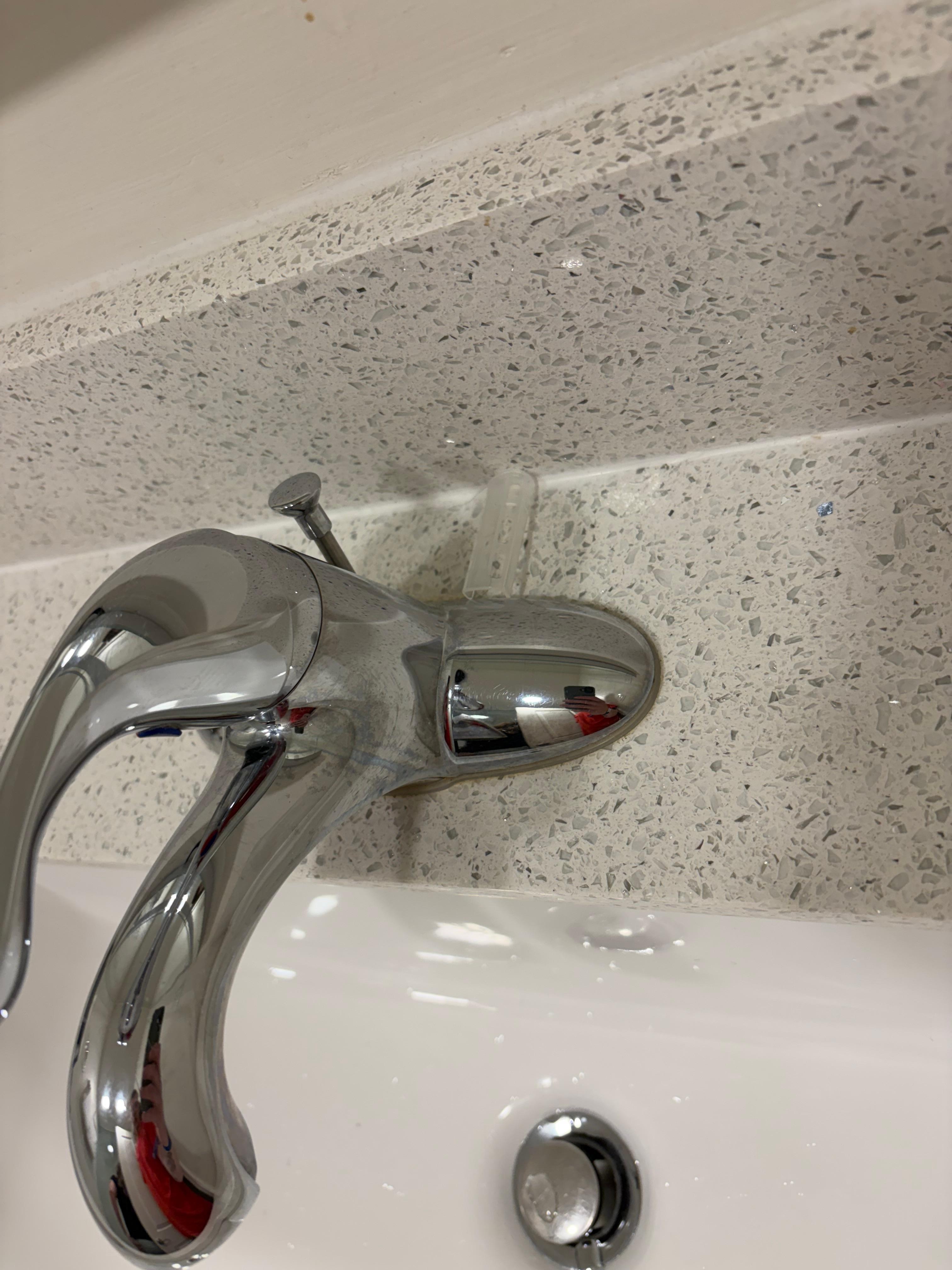 Dirty razor clip left in bathroom