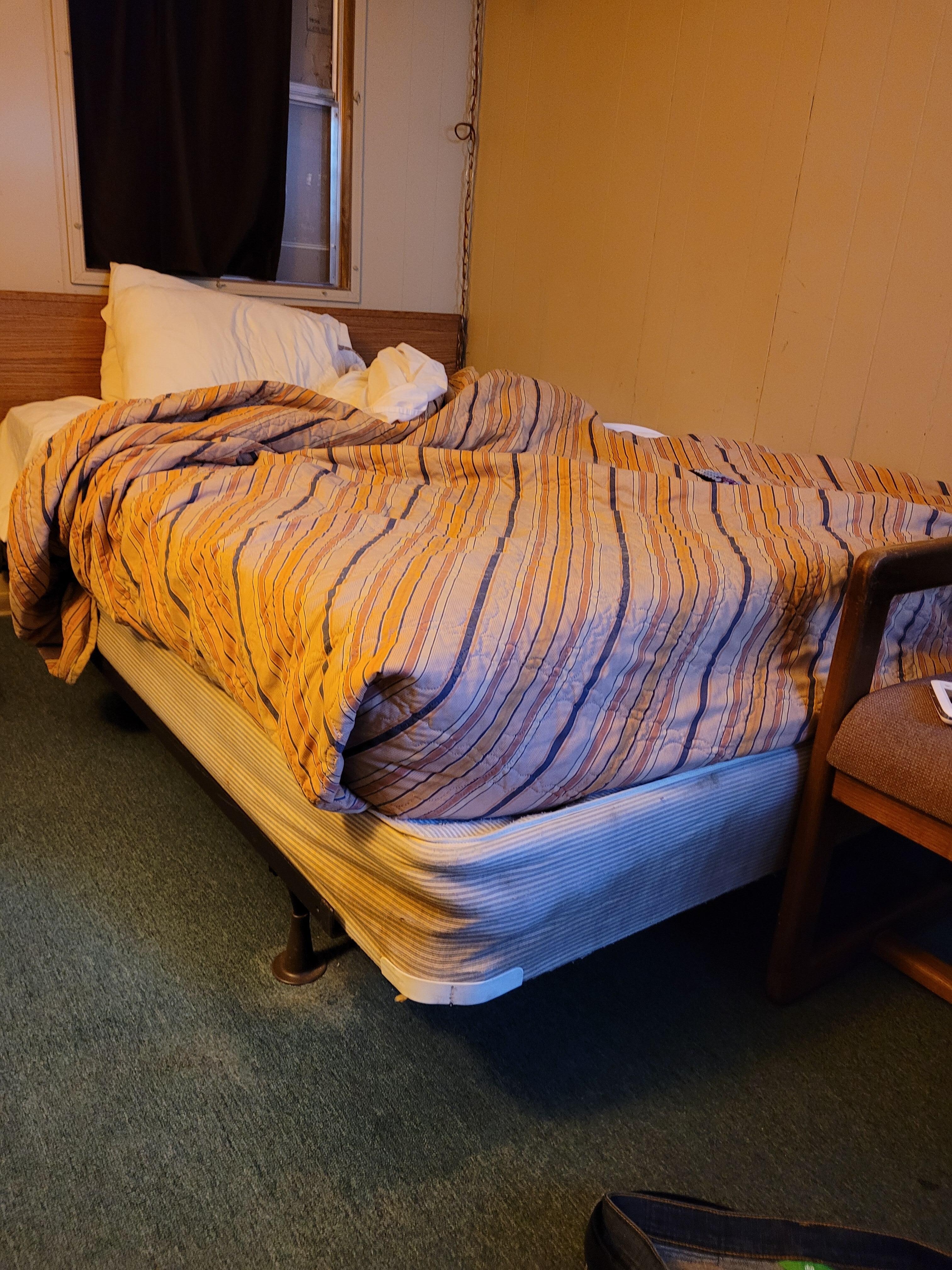 Boxspring was actually worse at the head of the bed, also broken glass above headboard. 