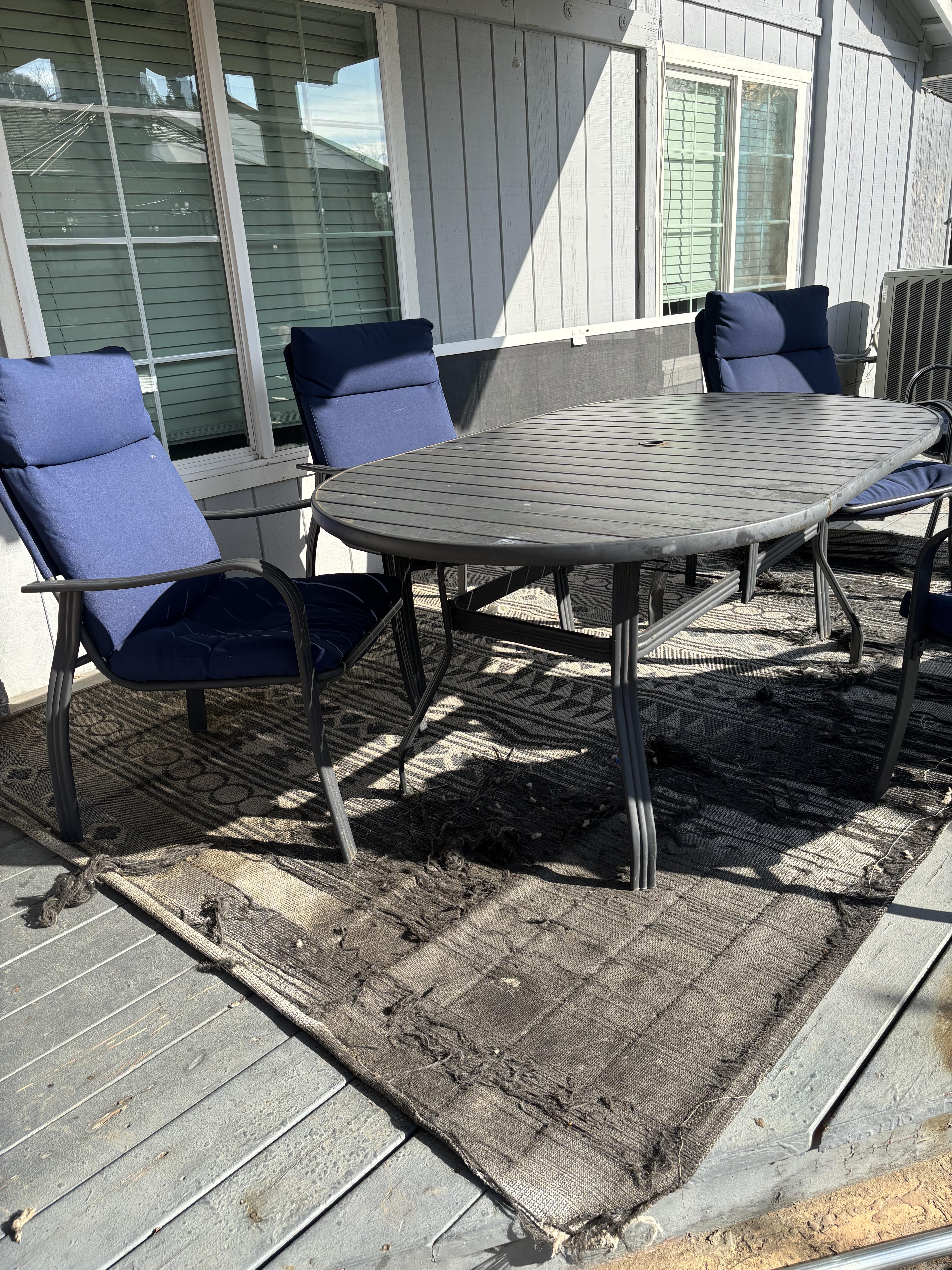 Dilapidated rug and patio furniture