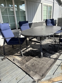 Dilapidated rug and patio furniture