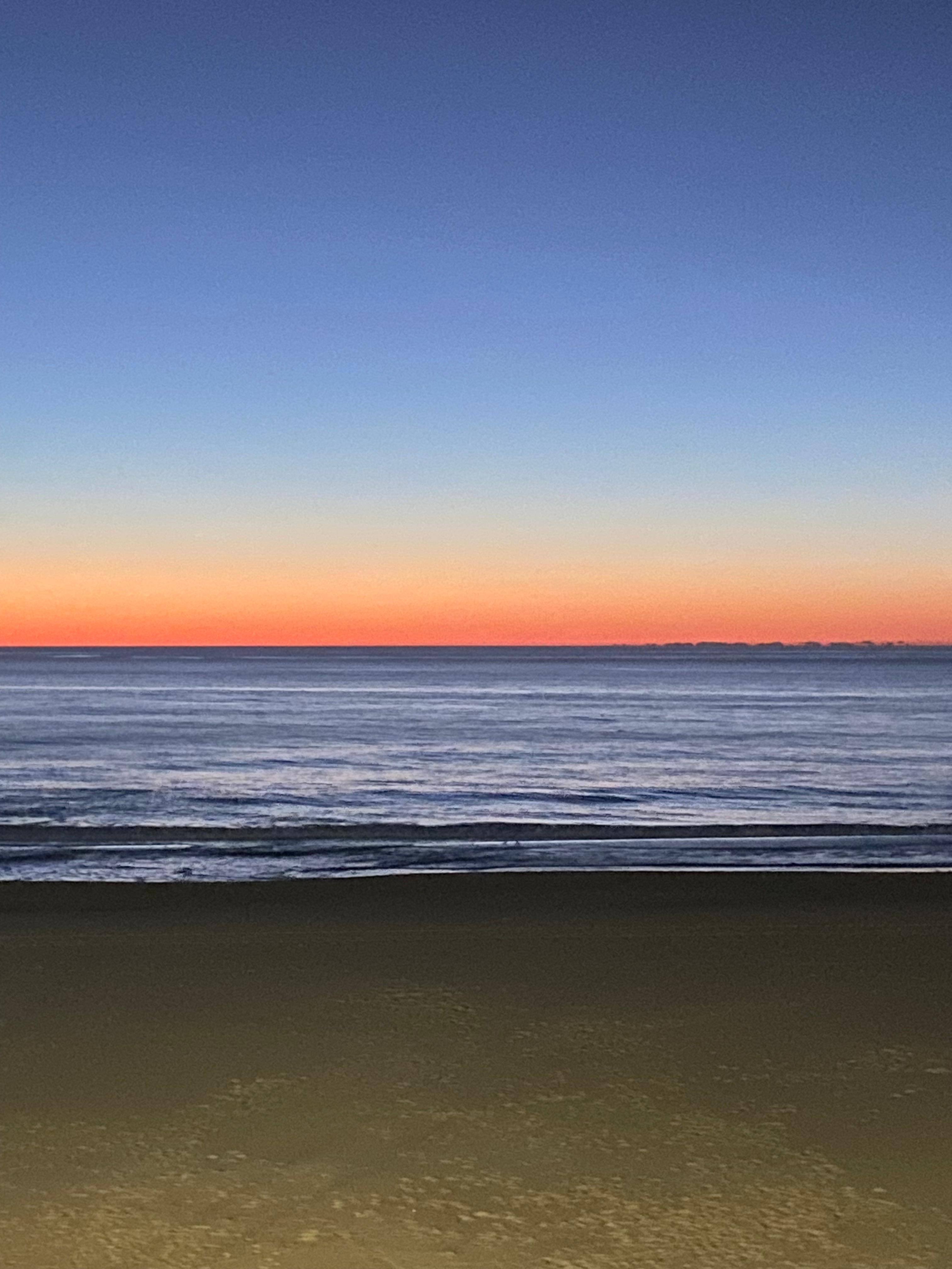 Sunrise from our 3rd floor balcony.