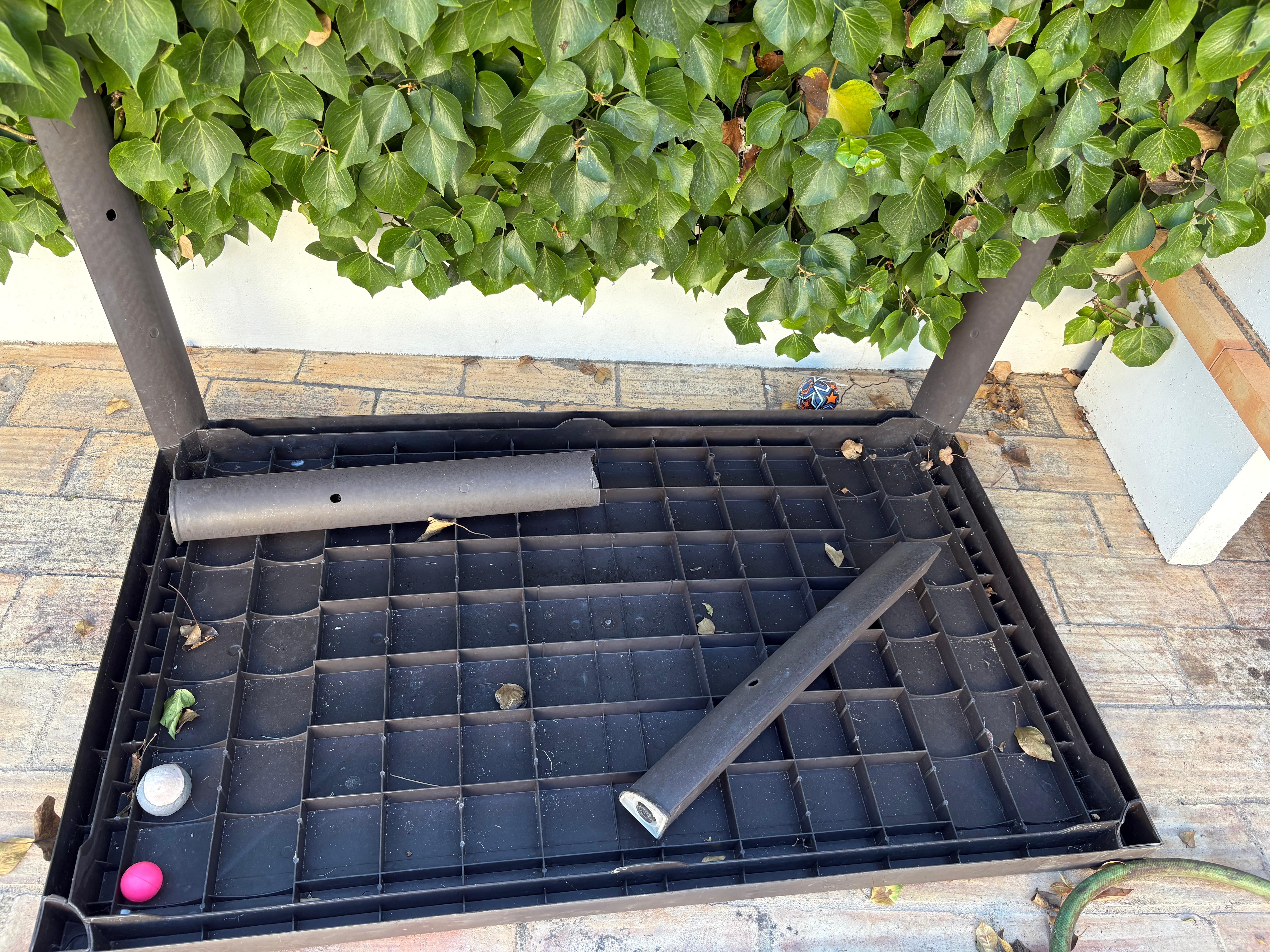 Broken chairs, table and cushions