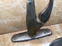 Old corroded fixtures. Corroded shower handle falls off. Very little water pressure. Hot water sometimes.