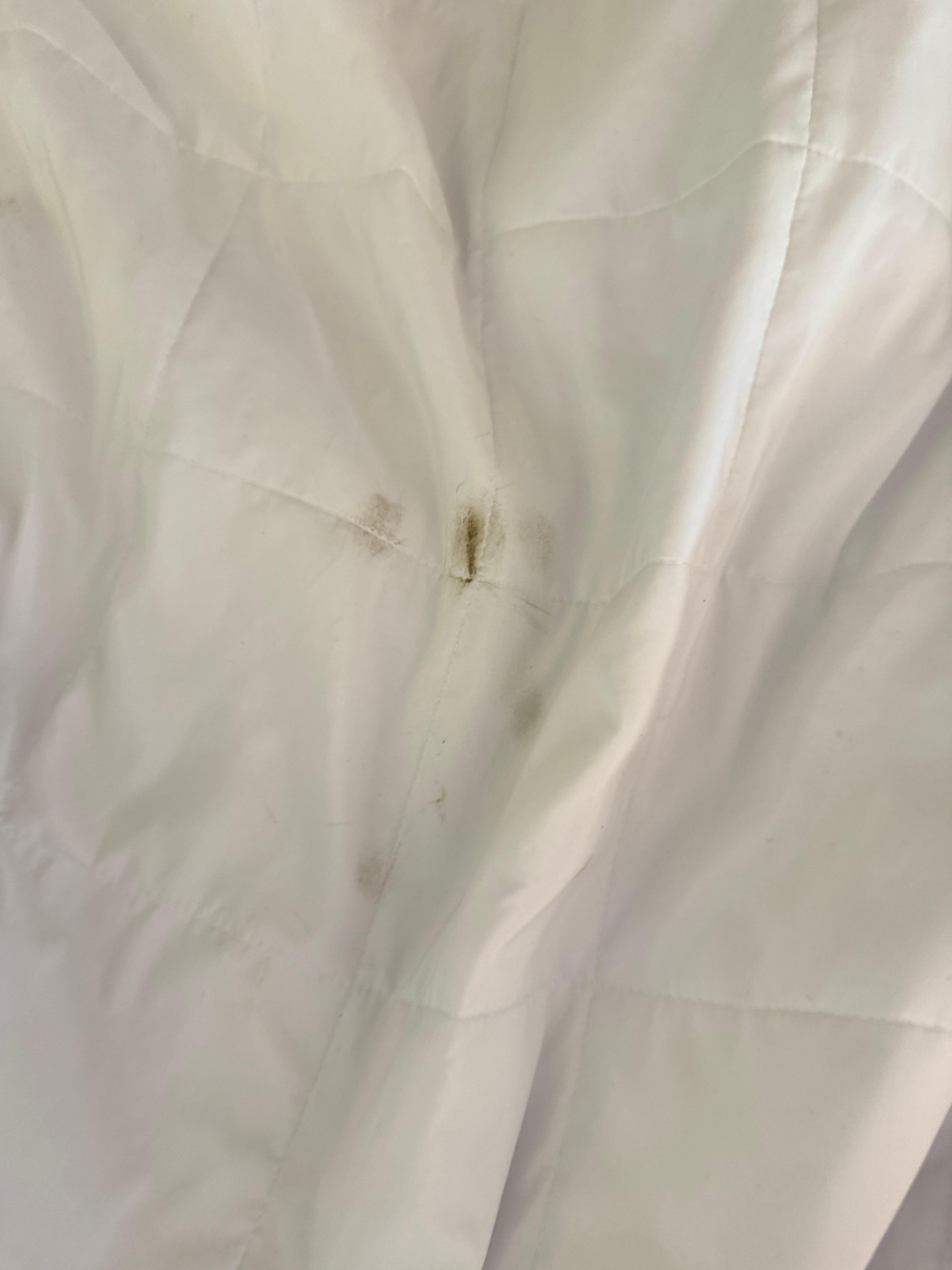 Dirty stains like this were all over the linens. (This is before dirt could transfer from OUR feet to the bed.)