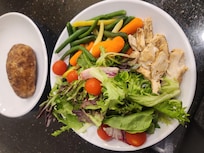 Dinner baked potato, fresh mixed green and yellow beans and carrots, along with a crispy salad and chicken...delicious!