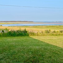 View from front porch. Two houses on either side.
