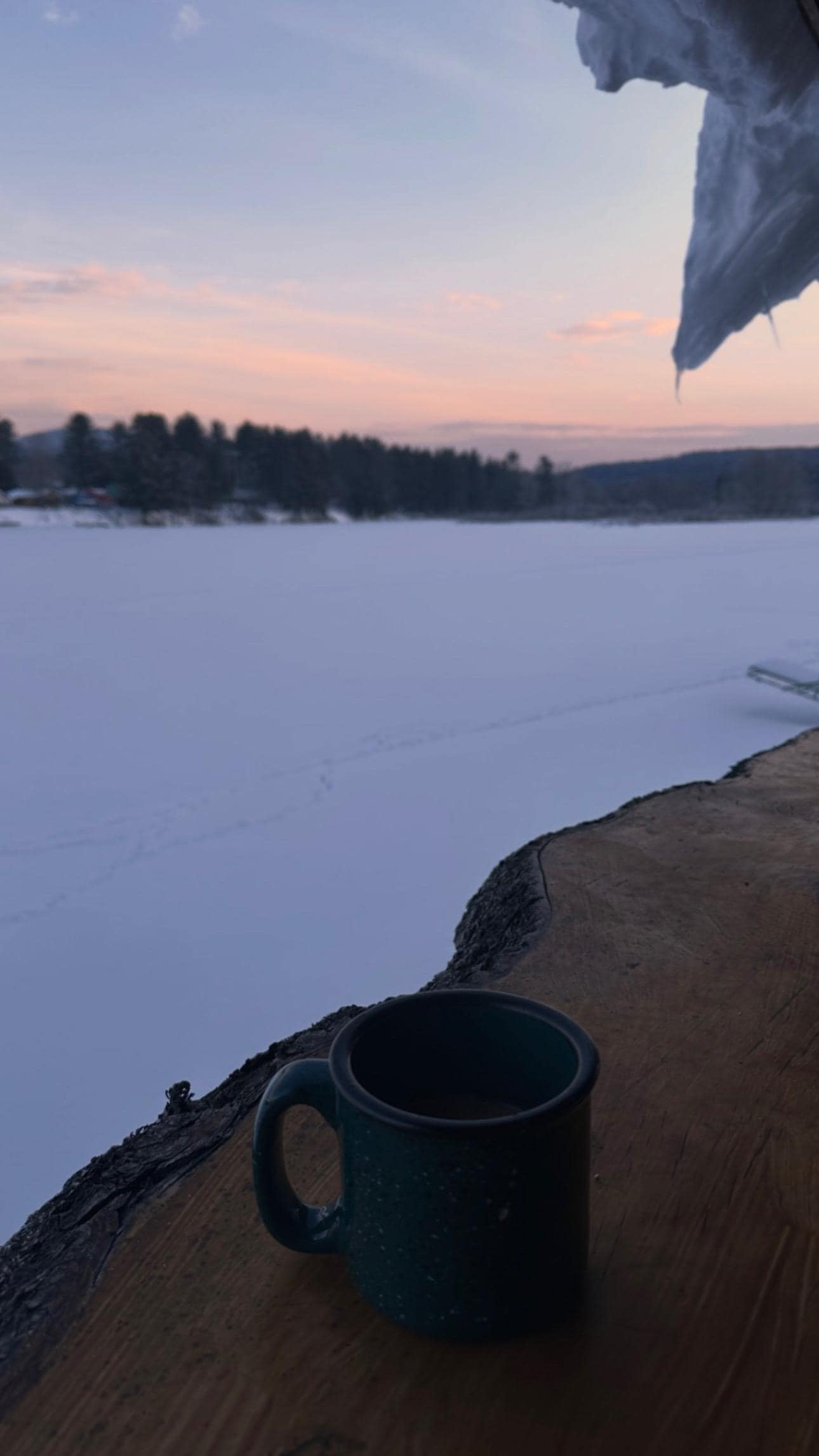 Waking up early to sip coffee while watching the sunrise over the frozen lake was pure peace.
