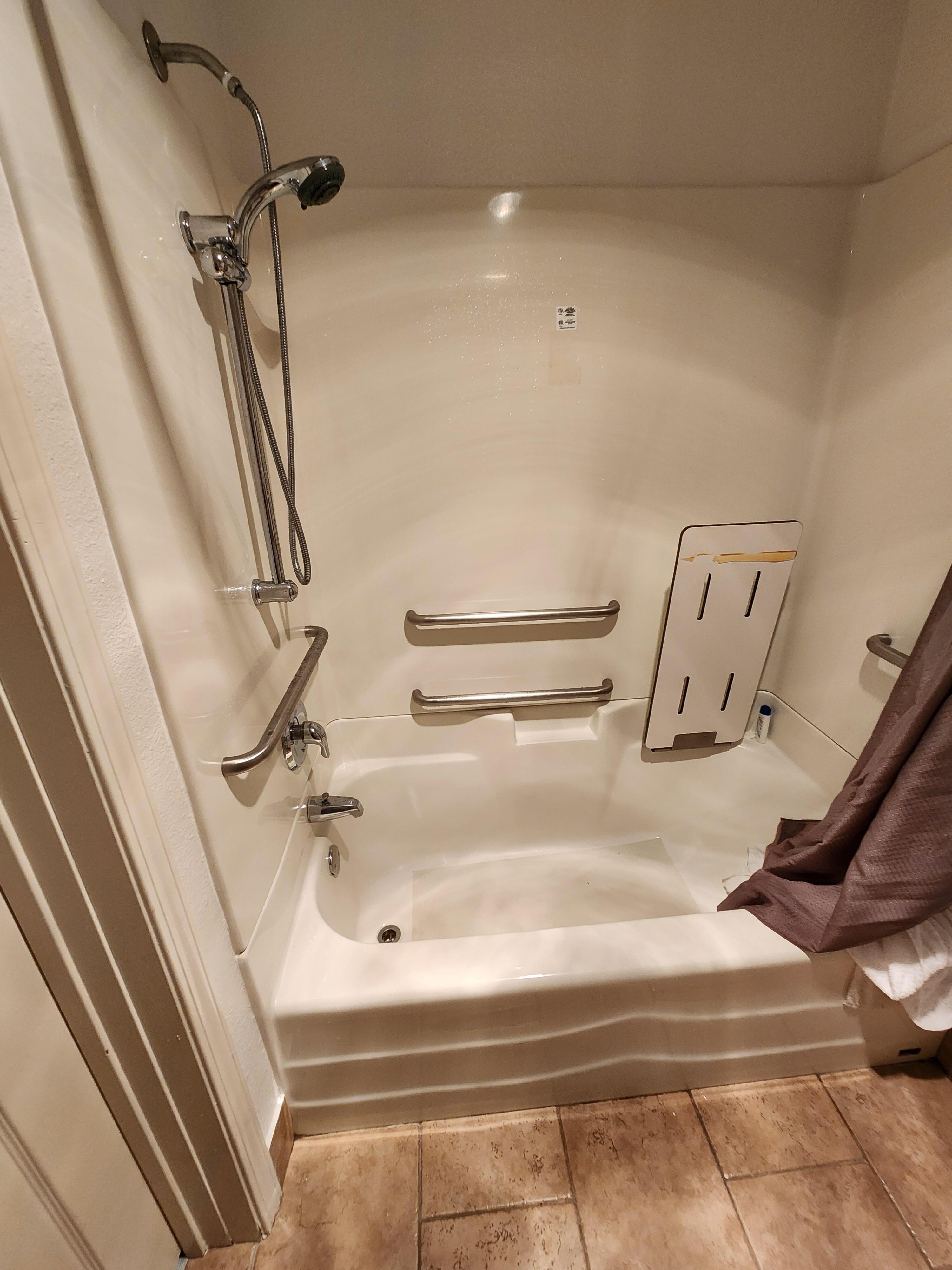 Lots of safety bars, sturdy seat, adaptable shower head and great pressure!