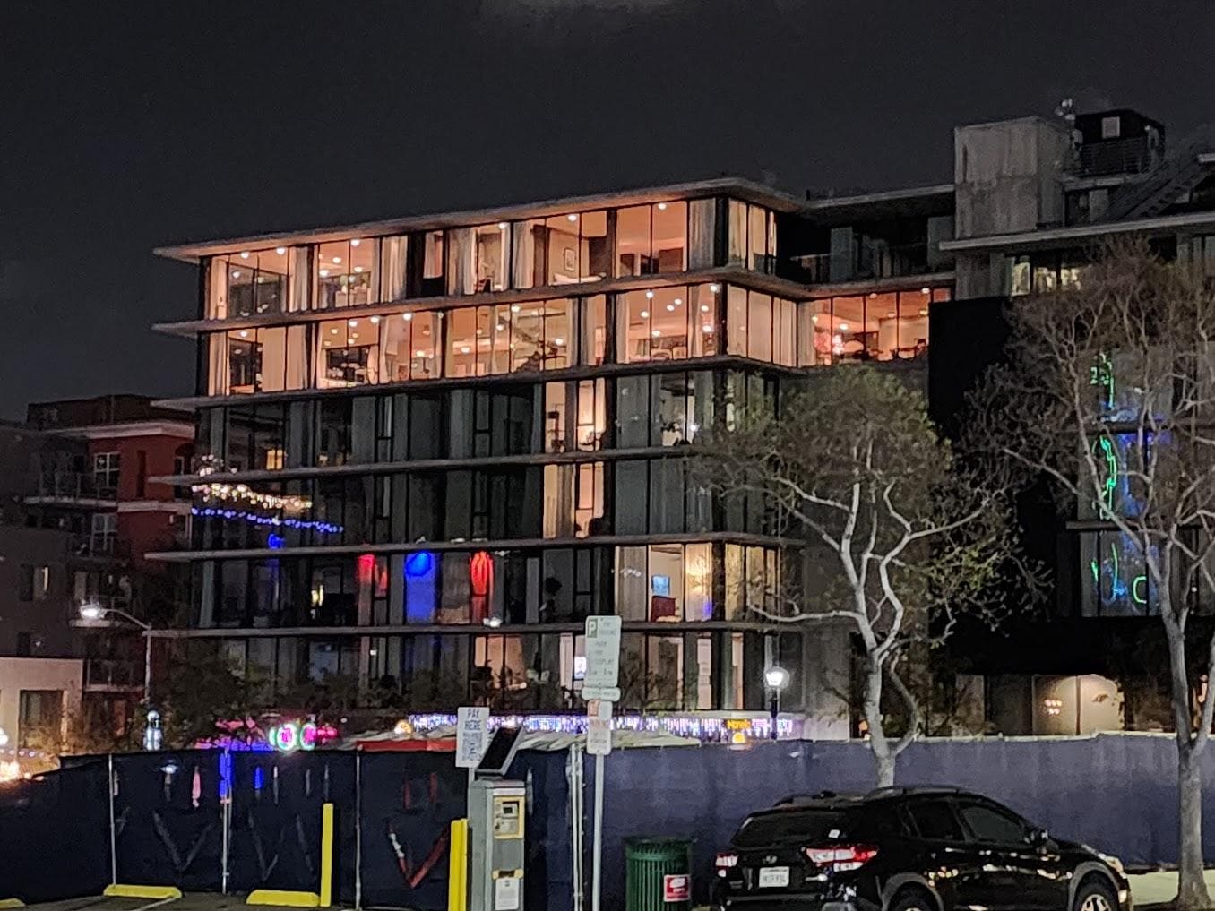 Beautiful night shot of the full condo from outside.