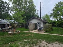 Outside of cottage. River is on the backside of the house on the left, down some steps and a rocky path.