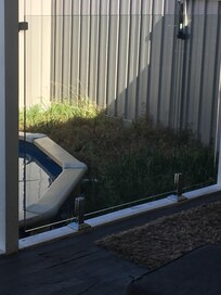 Garden? Around pool. How about ‘our well loved weed patch’.