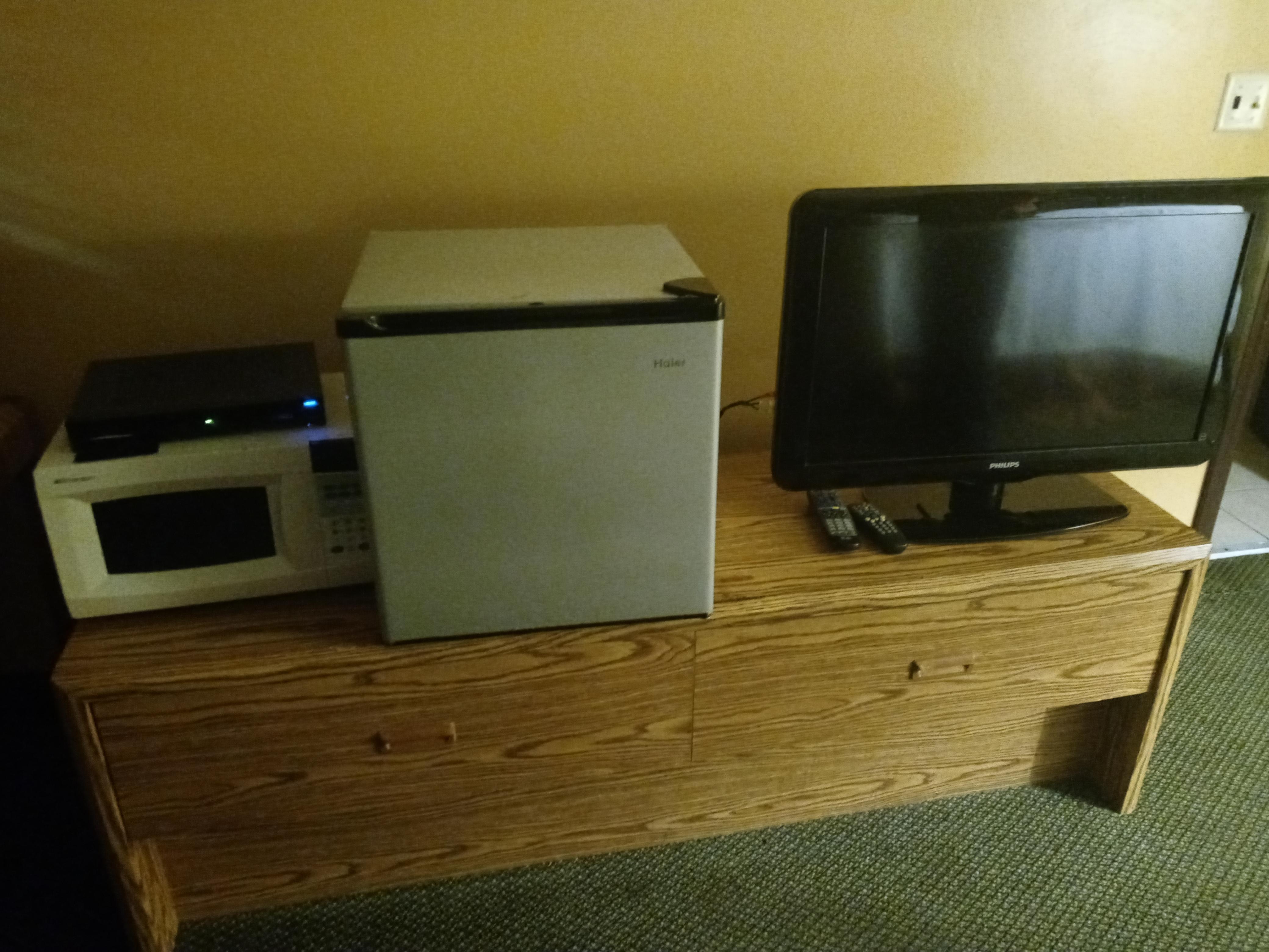 This shows the microwave, mini fridge, and TV.