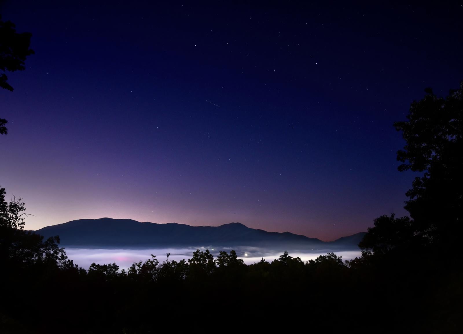 Starry pre-dawn from deck showing low lying fog in Bryson City