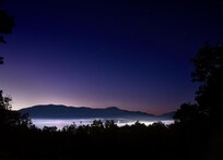 Starry pre-dawn from deck showing low lying fog in Bryson City