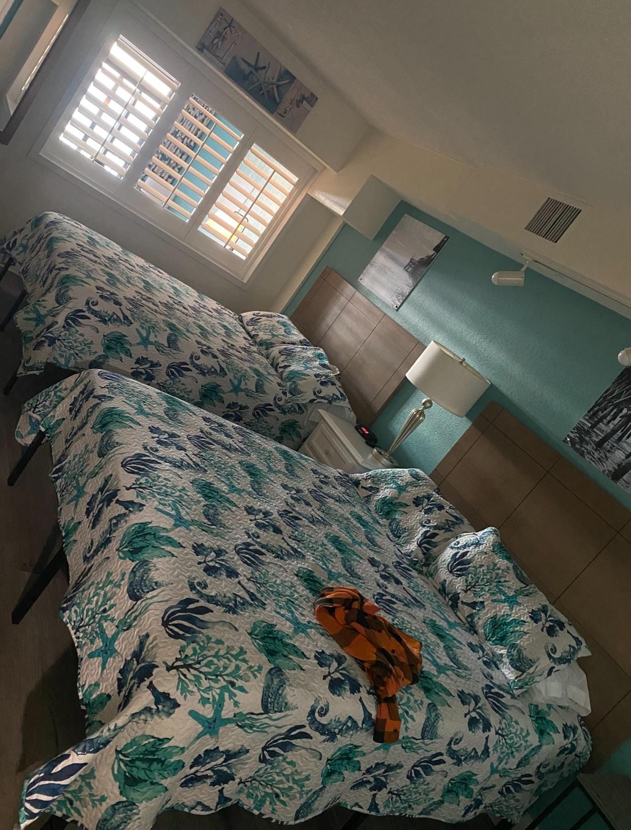 The bedroom with shutters opening into the living room. 