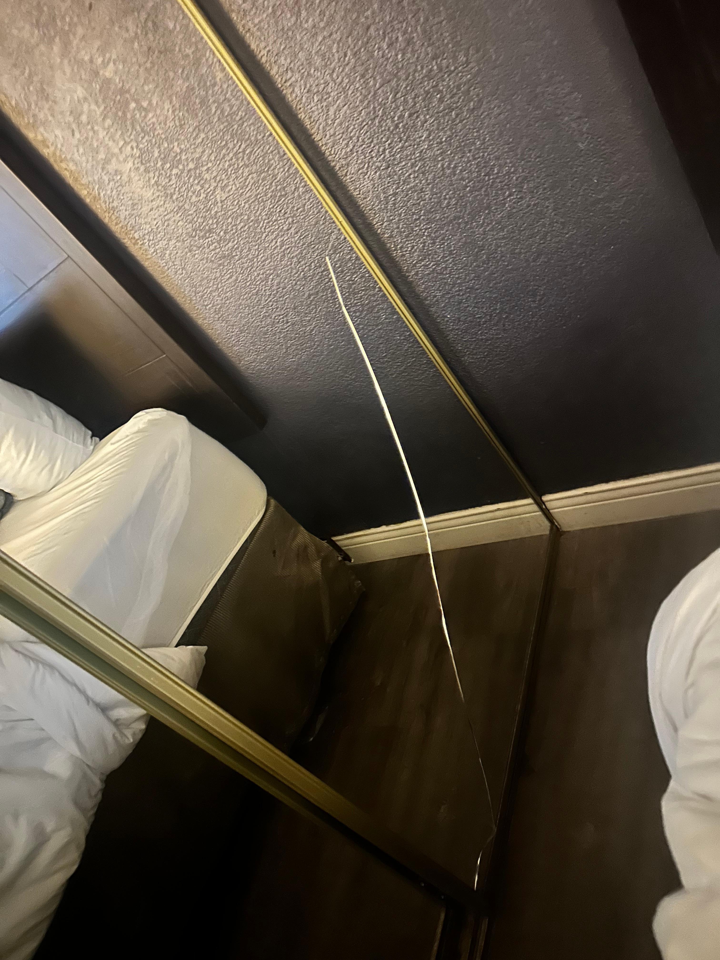 Broken mirror in bedroom