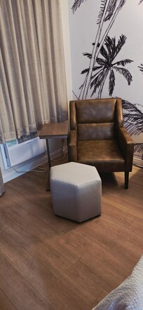 Chair and stool blocking air conditioner, needed to be moved at night to not block airflow.