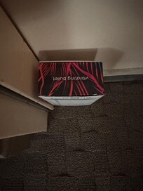 In between the conjoined room doors.