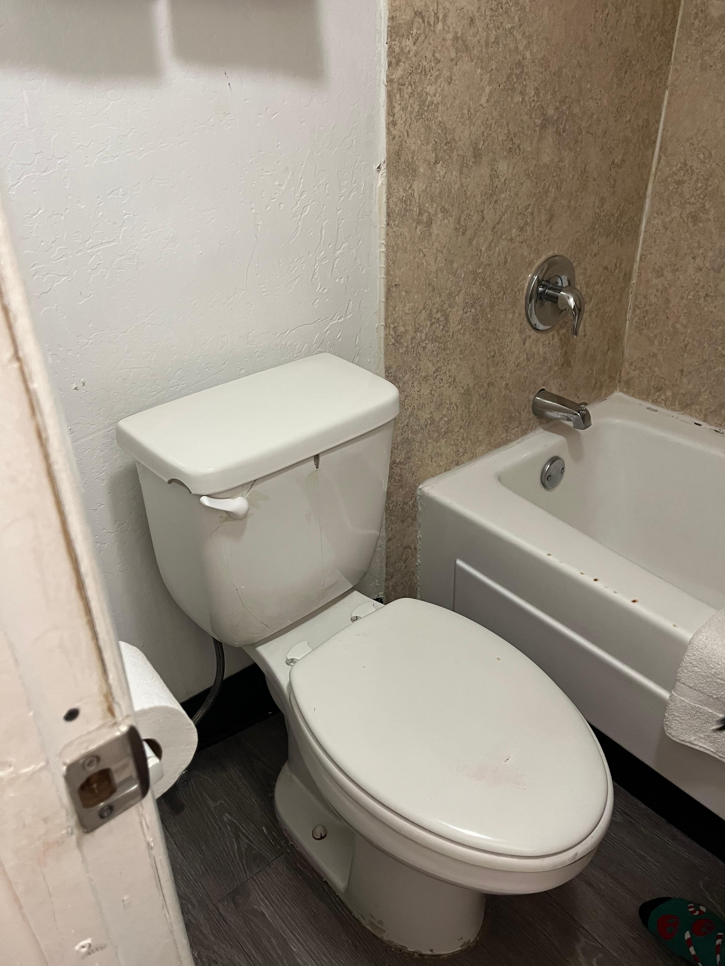 Zoom in to see the tank held together with masking tape. Note: the door does not close all the way