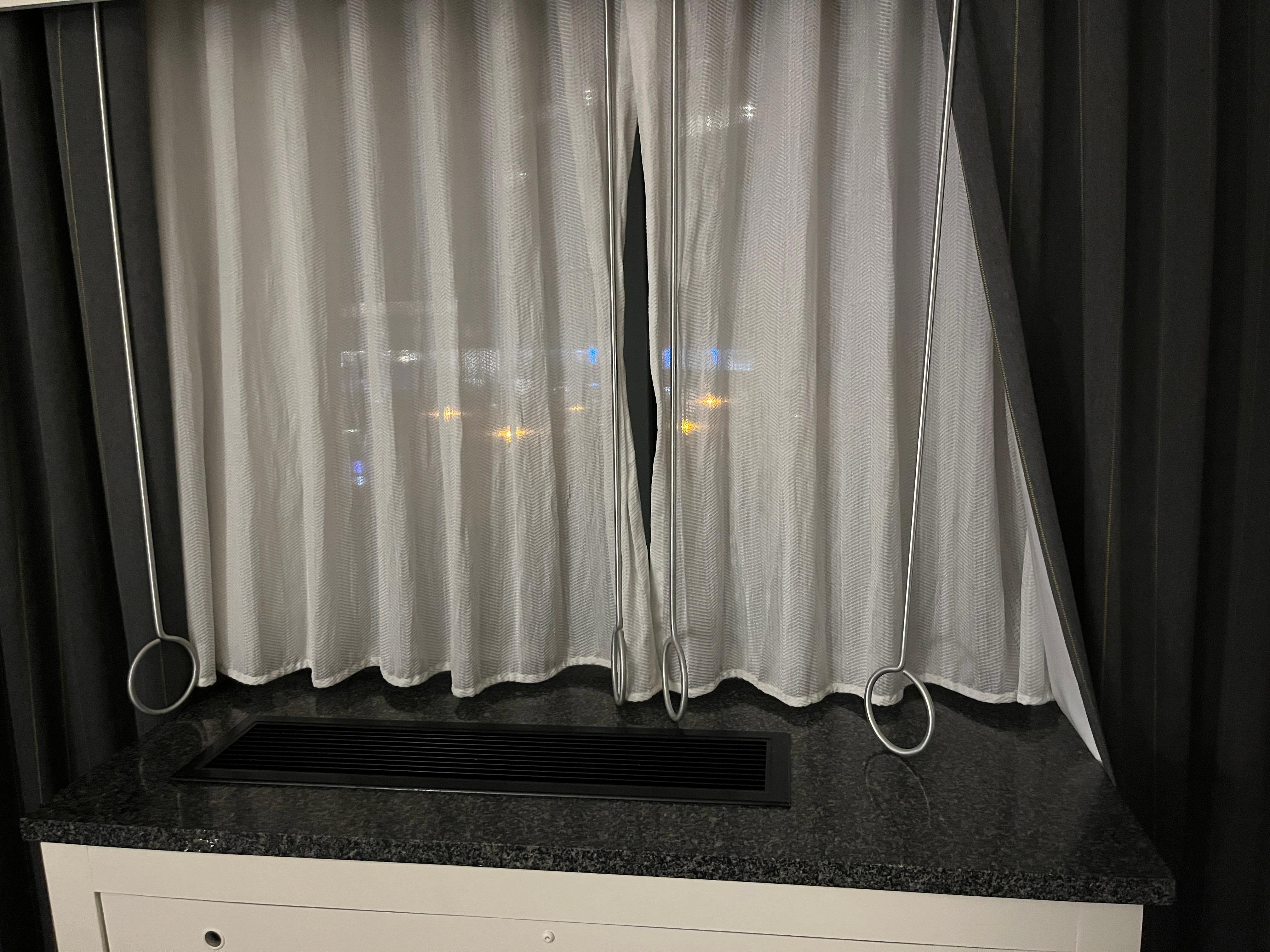 Not sure why, but couldn't seem to close the larger curtains for blackout effect.
