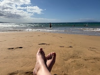 My son using the provided boards while I relax just a 3 minute walk from our place.
