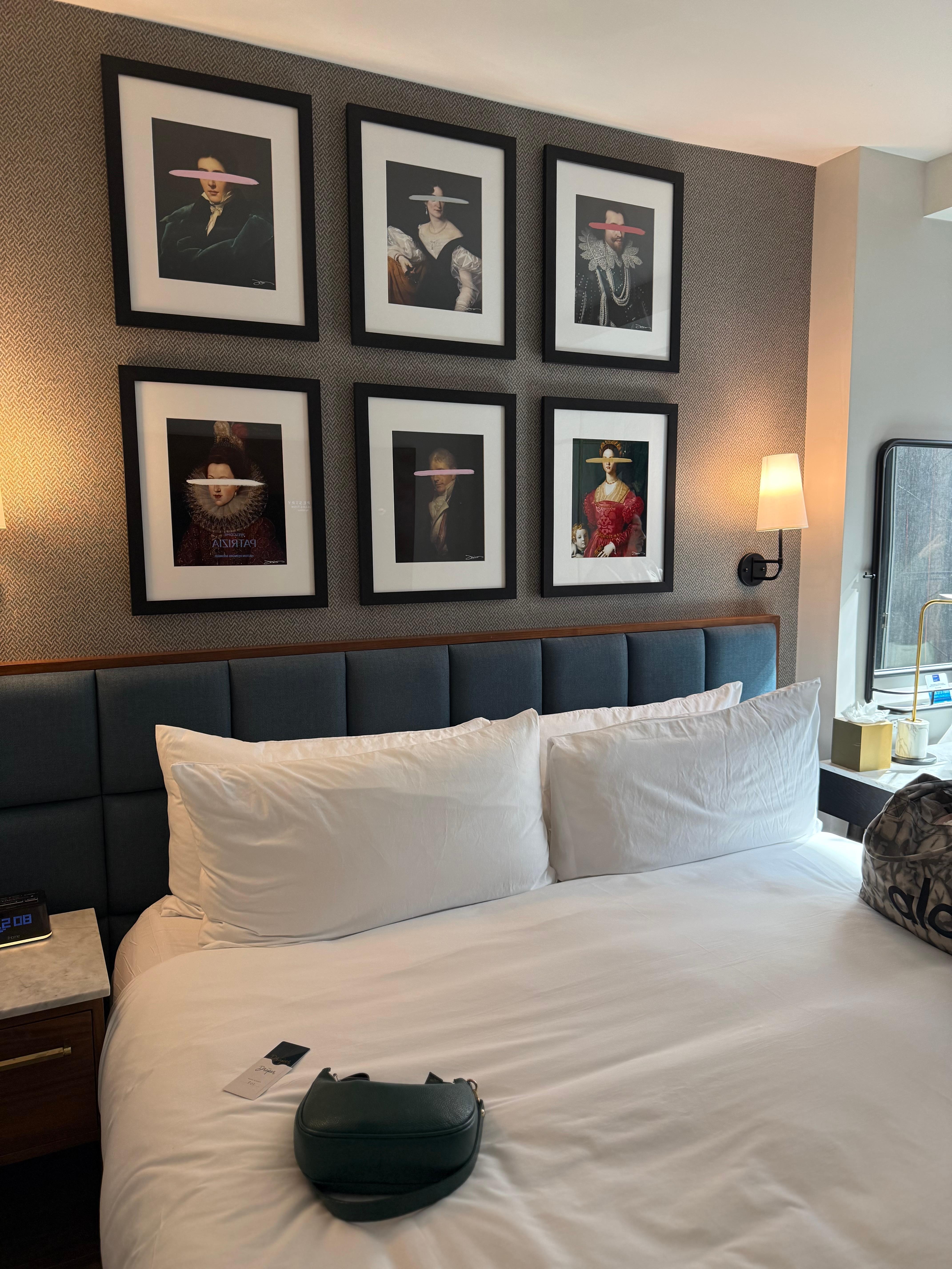 Loved the images on the wall above headboard. Also colors used through out the room were selected well. Loved the overall look and vibe. Clean too! 