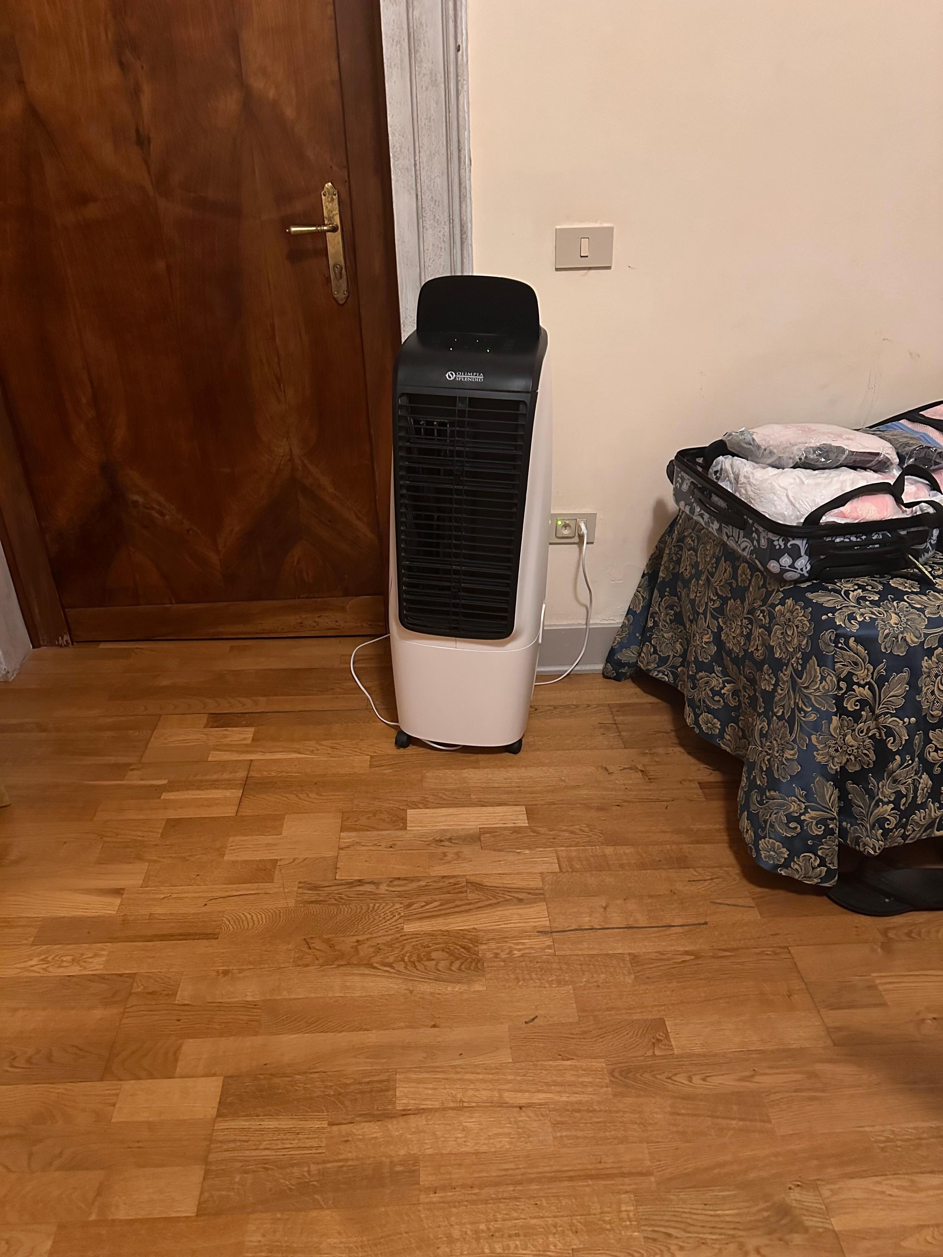 Warm air mover. Does not cool down the room or provide any air conditioning