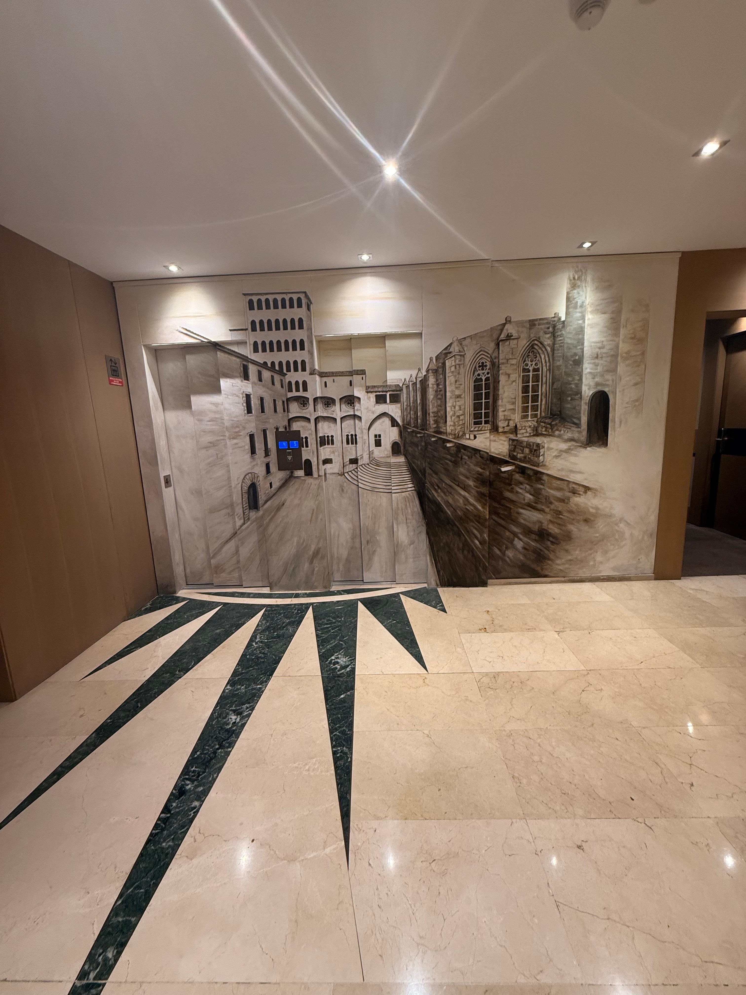 Each floor has painted elevators doors representing a part of the Gothic 