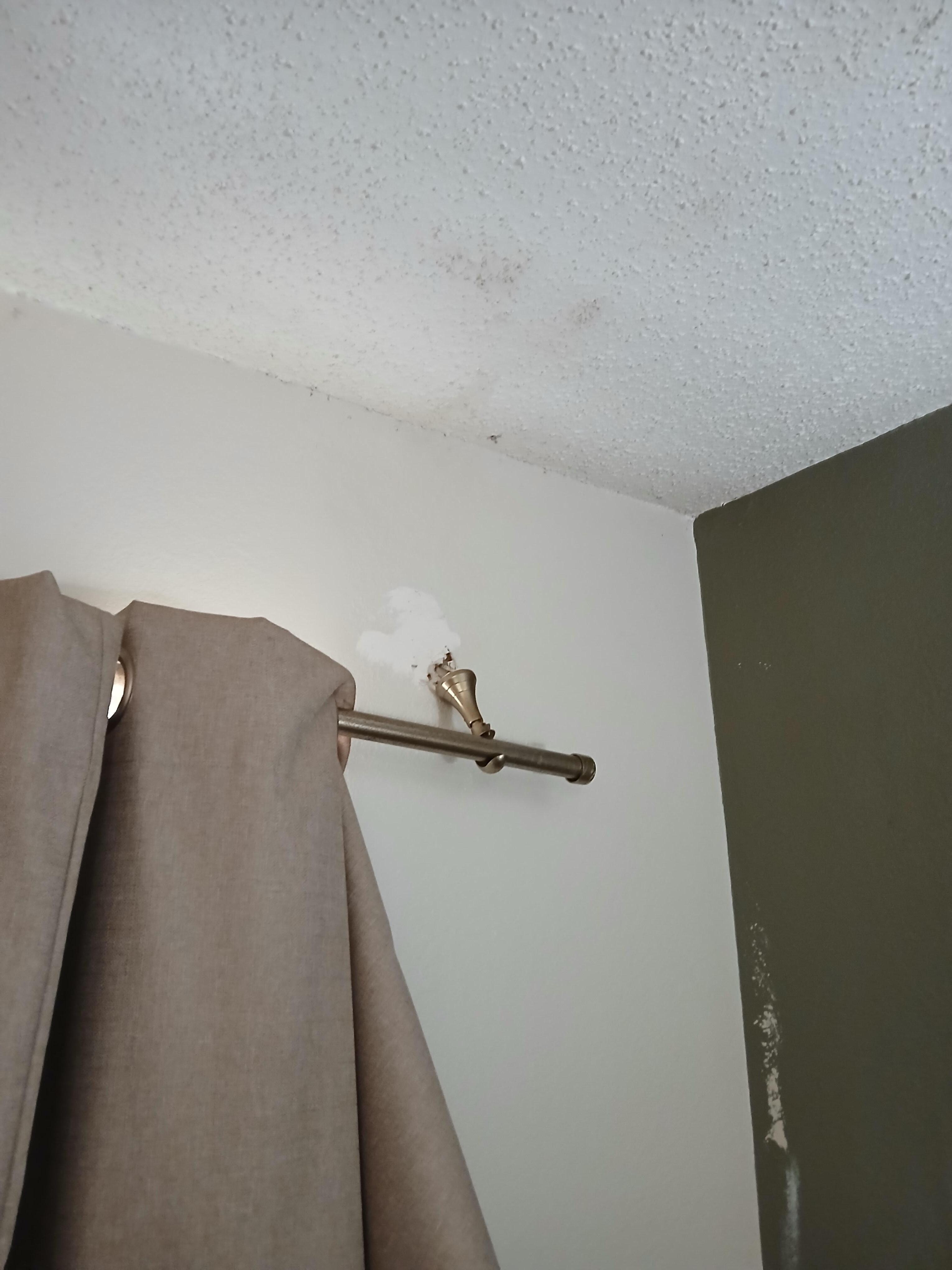 Broken curtain rod.