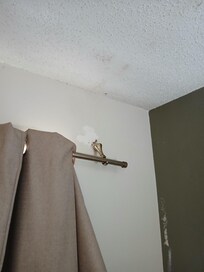 Broken curtain rod.
