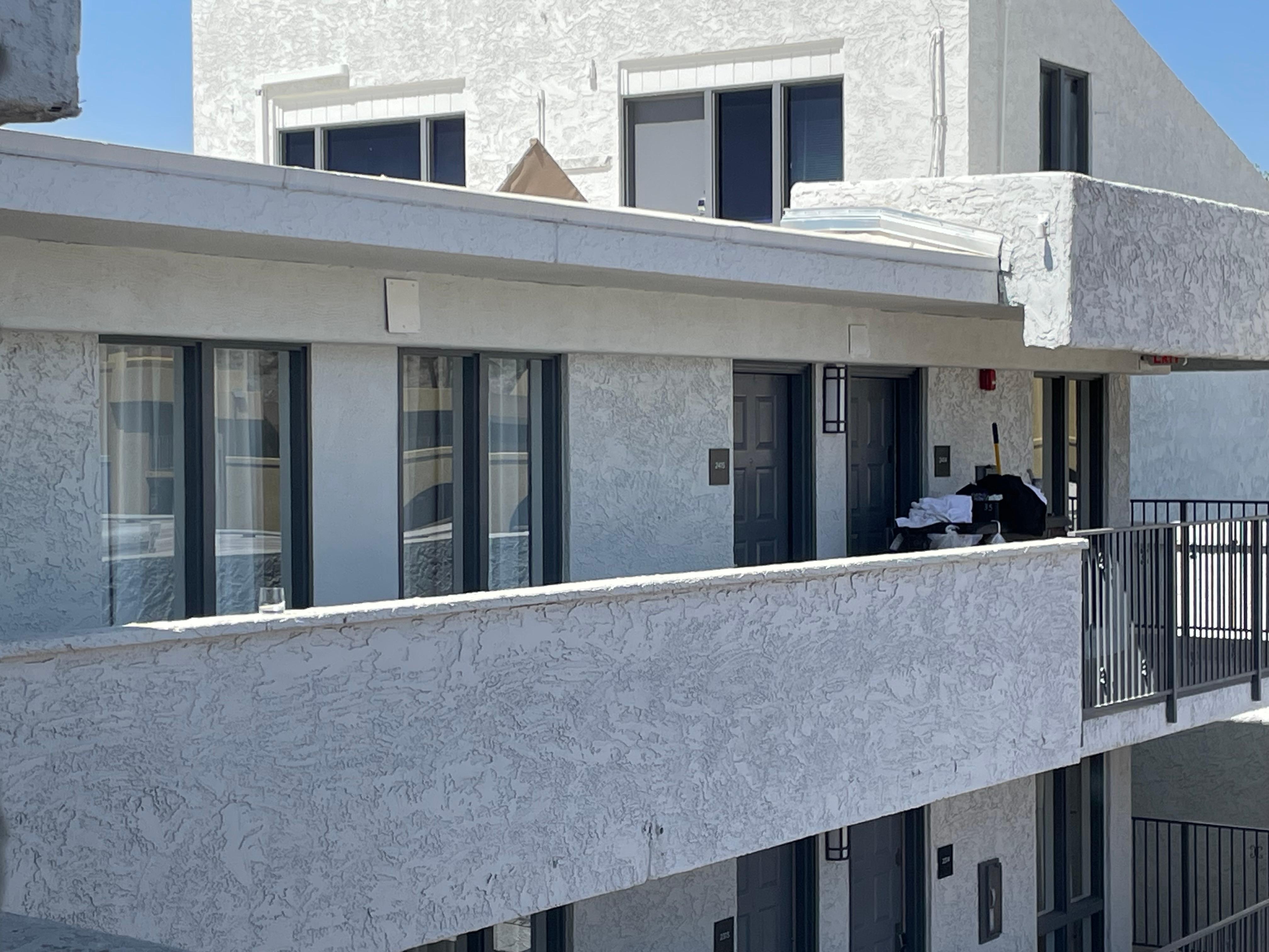 I was on the 4th floor and took this picture from my room. There was a glass on a ledge four floors up, yet no one bothered to put it up. 