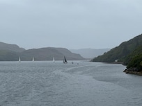 Sailboat race looking back towards the cottage and boathouse