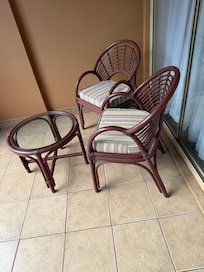 Chairs and a table in the balcony of the bedroom
