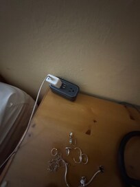 Only outlet in the room for phone/electronics.