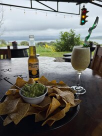 Pina colada and an ice cold beer to go with the most delicious guacamole