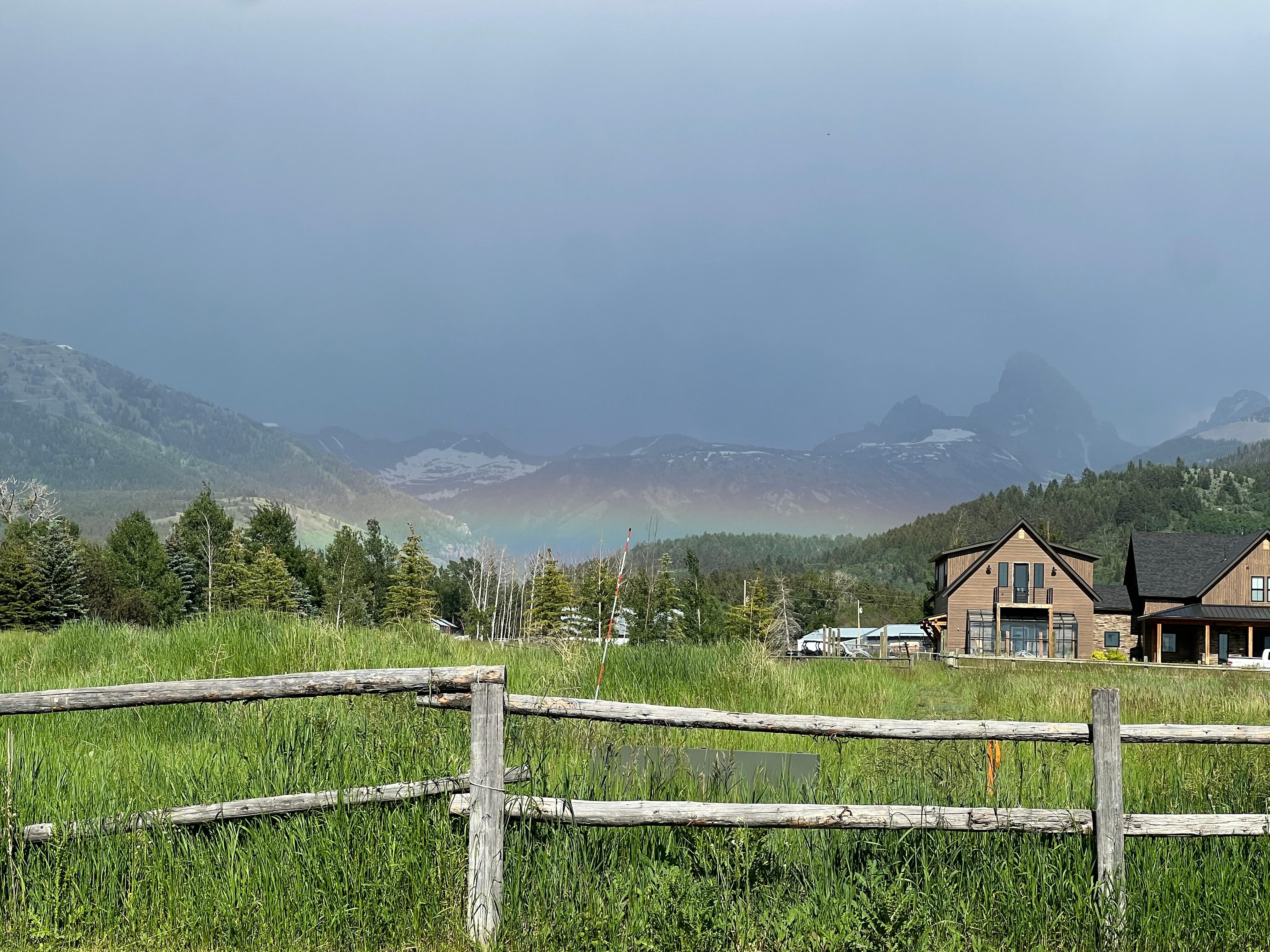 Rainbow arising from the ground after storm