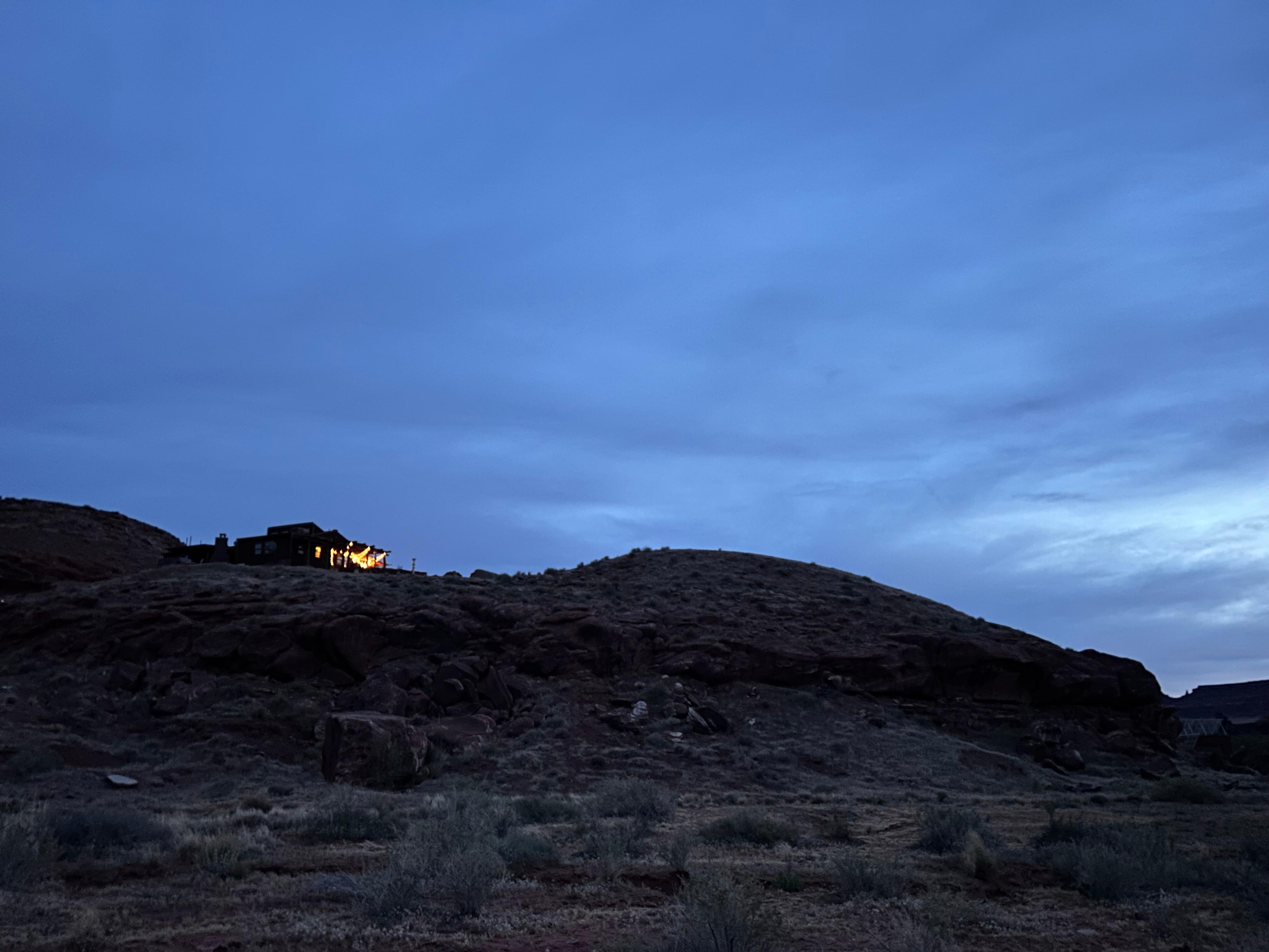 Main house at night from the back 