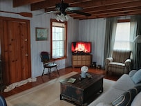 Cozy main room. A fireplace from YouTube completes the look.