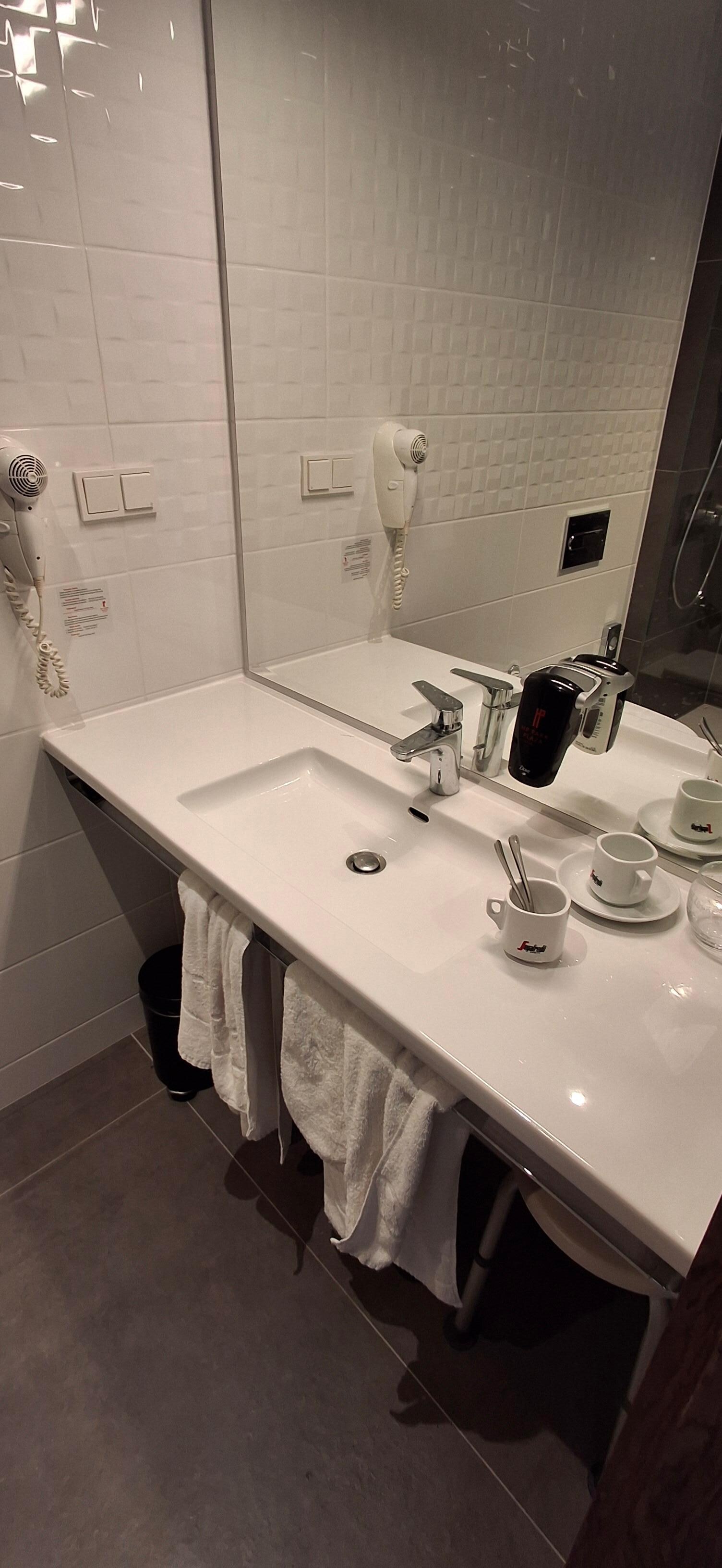 Well equipped bathroom with hairdryer and soap etc.
