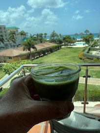 Matcha tea with view in the background.