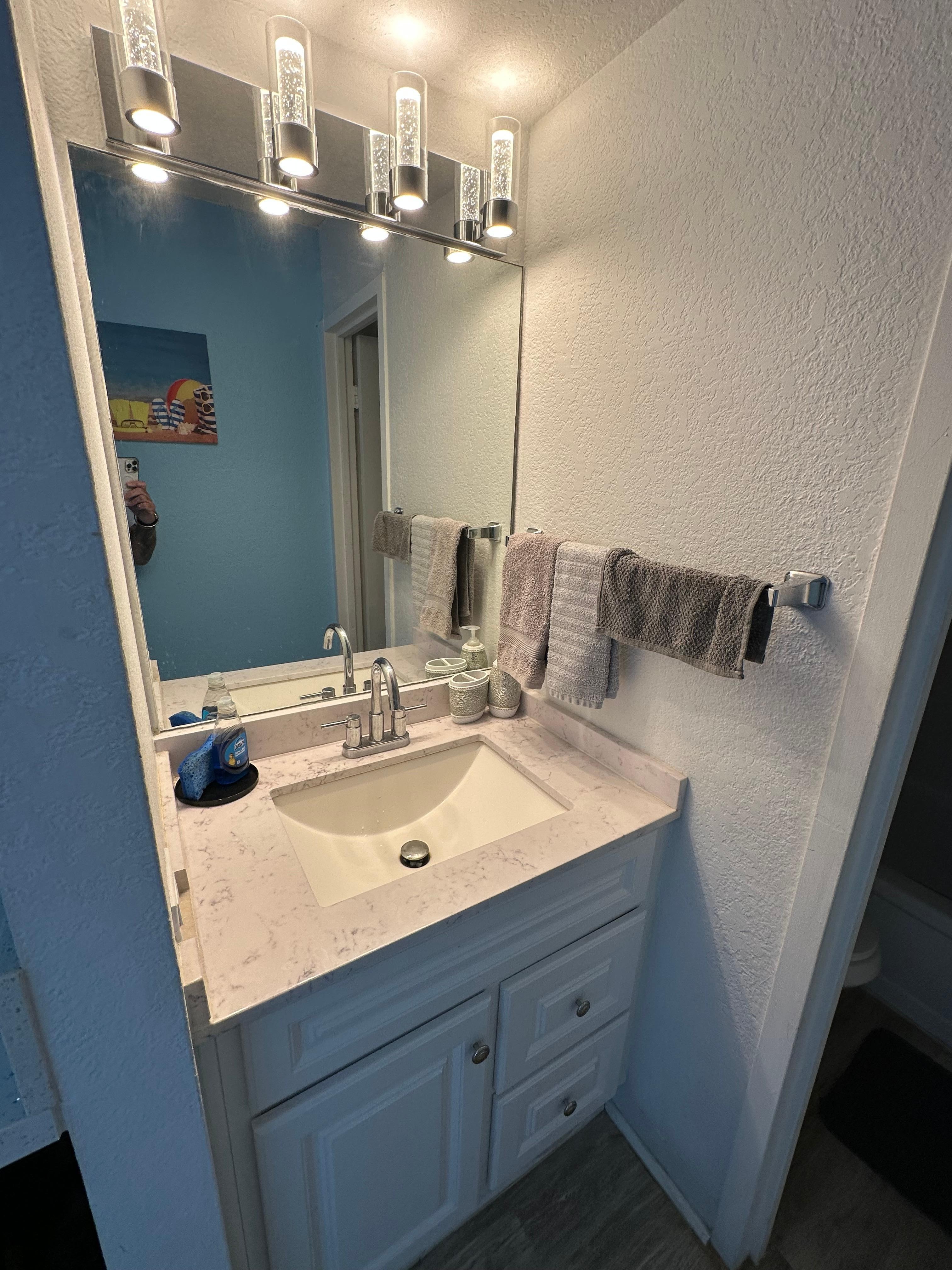Area with mini-fridge, coffee machine, microwave and Sink