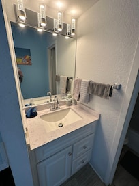 Area with mini-fridge, coffee machine, microwave and Sink