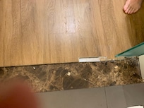 Gap betaen bathroom times and floor