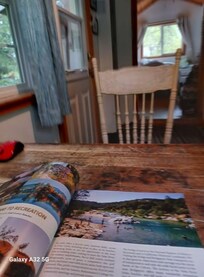 Inside kitchen looking at a guide provided by the property