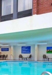 Zoom in on the white wall and you will see the stains when i was there it was black and dripping from air con unit see window above straight in to the pool!