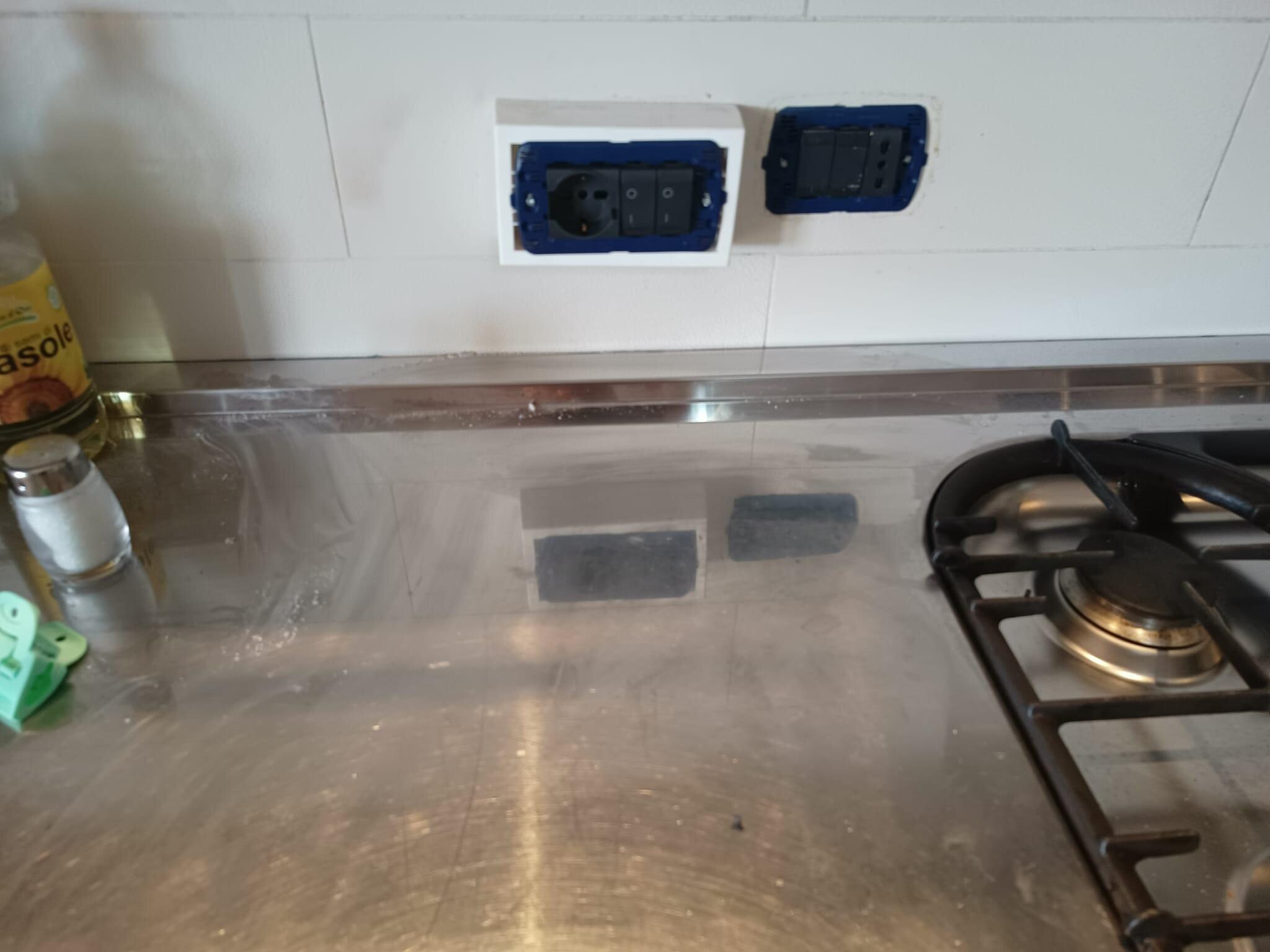 Kitchen outlets after the fix. They left the counter dirty.