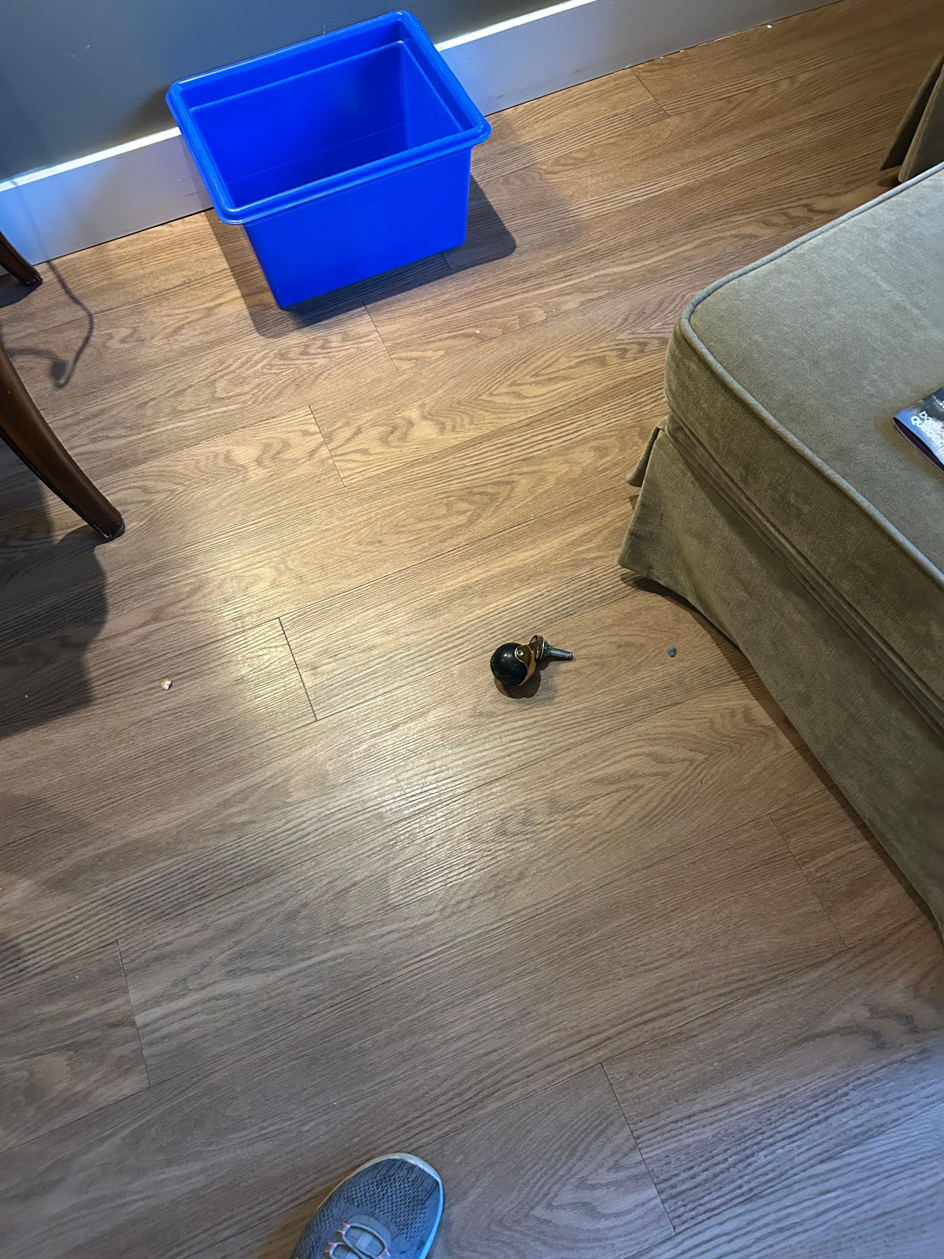 Wheel broken off footstool.