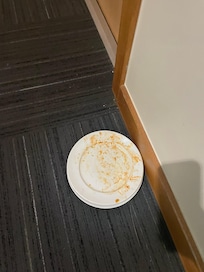 Dirty dishes outside of my room before checking in