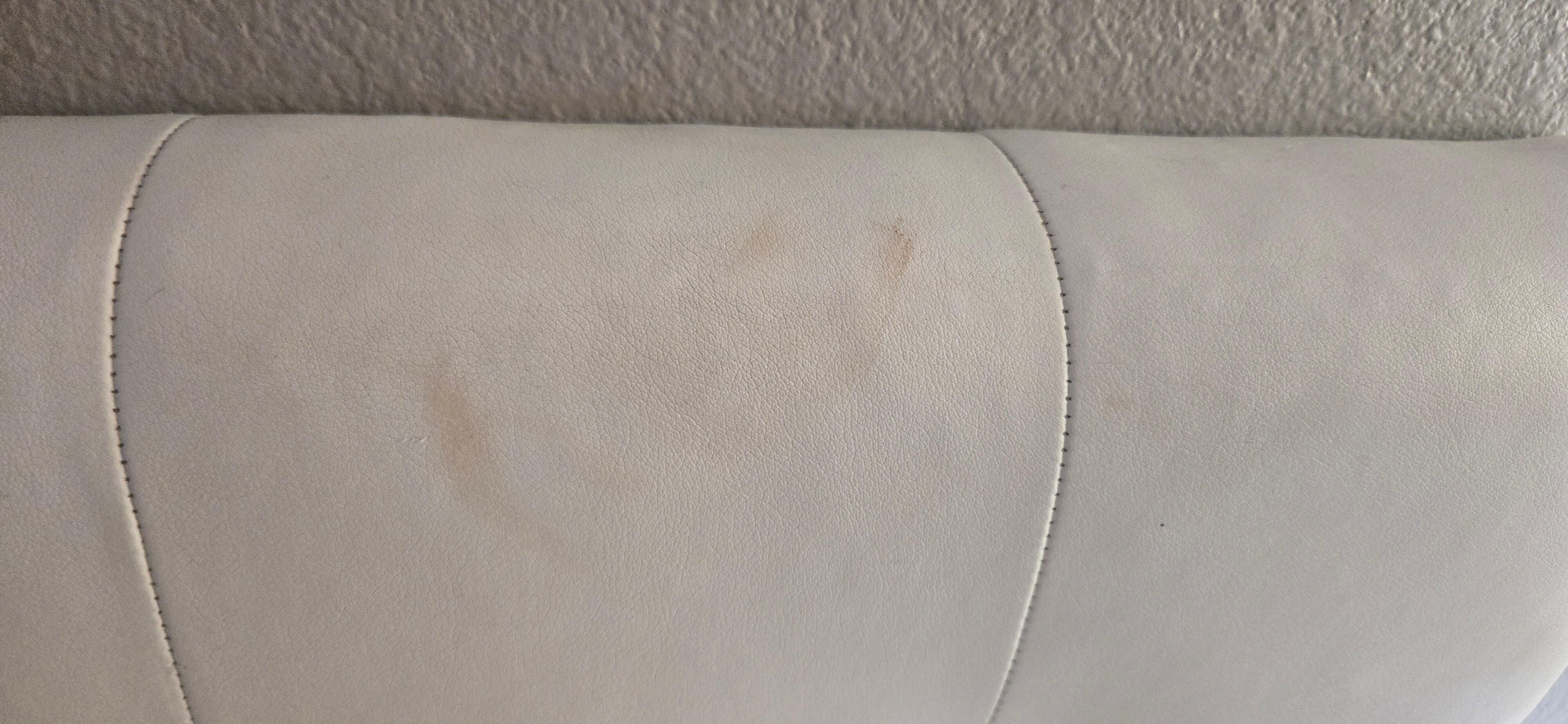 Red stain on head board.  Blood? Idk