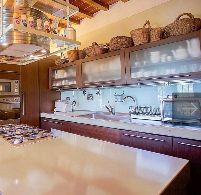 Kitchen stovetop and sink. Plenty of storage and kitchen necessities provided.